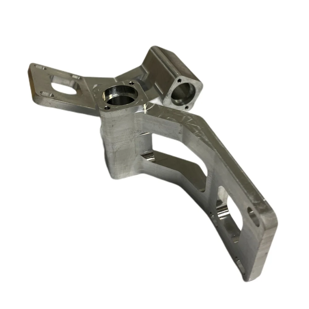 Machined formed equipment arm bracket